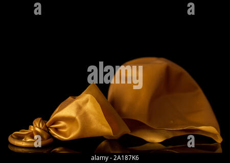 Un ensemble de latex ballon pastel orange isolé sur verre noir Banque D'Images