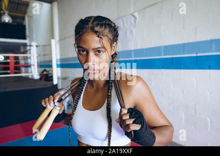 Boxer looking at camera in boxing club Banque D'Images