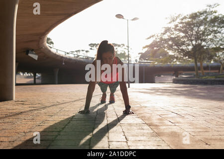 Woman exercising in a park