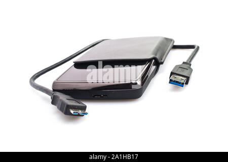 a portable harddisk in  soft leather case and USB cable on white background Banque D'Images