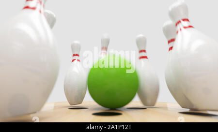 Bowling strike, Green ball renverse des quilles. Banque D'Images