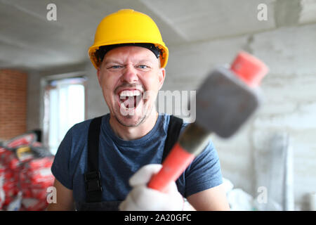 L'homme fou avec sledgehammer Banque D'Images