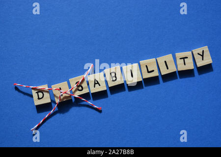 L'invalidité en 3d, avec des lettres en bois Dis barré, laissant le mot Capacité Banque D'Images