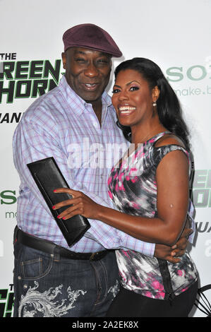 LOS ANGELES, CA. 10 janvier 2011 : Michael Clarke Duncan & Omarosa Manigault-Stallworth au Los Angeles premiere de 'Le Frelon Vert' au Grauman's Chinese Theatre, à Hollywood. © 2011 Paul Smith / Featureflash Banque D'Images