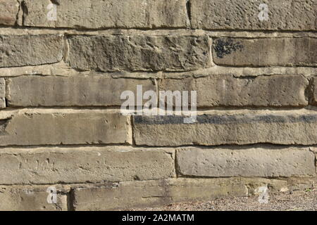 Un vieux mur de pierre. Banque D'Images