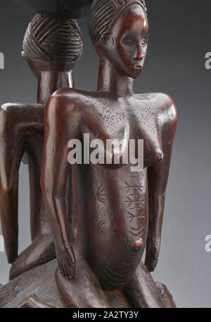 Tabouret avec janus des figures féminines, Zela, début xxe siècle, bois, 15-1/8 x 9 x 9 in., l'Art Africain Banque D'Images