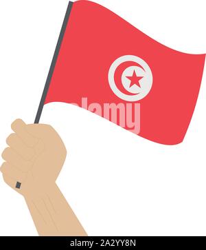 Main tenant et élever le drapeau national de la Tunisie Illustration de Vecteur