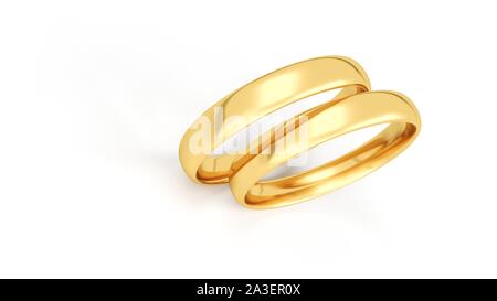 Anneaux de mariage d'or isolé sur fond blanc. Banque D'Images