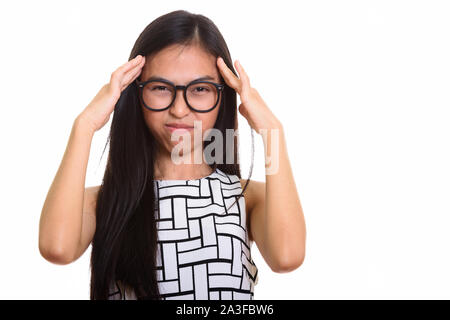 Young Asian teenage girl nerd ayant des maux de tête Banque D'Images