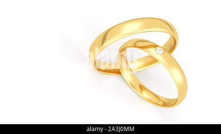 Anneaux de mariage d'or isolé sur fond blanc. Banque D'Images