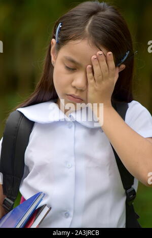 Cute Asian Girl Student et tristesse avec des livres Banque D'Images