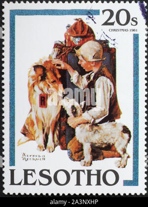 ⁮Illustration par Rockwell avec enfant et chien, timbre-poste Banque D'Images