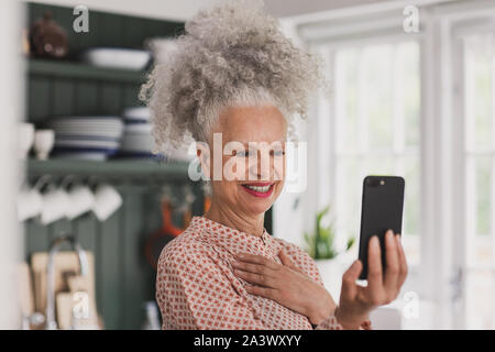 Senior woman on a vidéocall en famille Banque D'Images