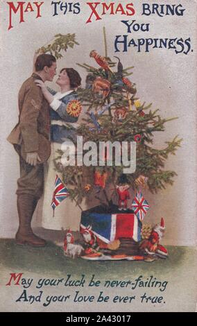 Noël Vintage Carte postale montrant l'homme en uniforme s'embrasser sous le gui épouse. L'homme à la guerre. Patriotiques. Des années 1900. Banque D'Images