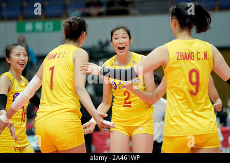 Ting Zhu de Chine, deuxième à partir de la droite, rires de célébrer au cours de la deuxième tour de 2019 de Volleyball FIVB Women's World Cup contre l'unité Banque D'Images