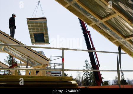 La construction d'une maison de l'homme - les éléments de construction Banque D'Images