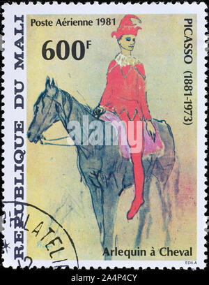Peinture 'à cheval' arlequin de Picasso sur stamp Banque D'Images