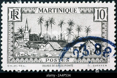 Village de Martinique sur timbre ancien Banque D'Images