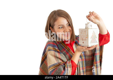 Fille en robe de Noël avec lampe dans sa main Banque D'Images