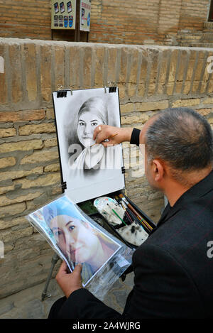 Scène de rue dans la vieille ville de Khiva (Itchan Kala), site du patrimoine mondial de l'Unesco. L'Ouzbékistan Banque D'Images