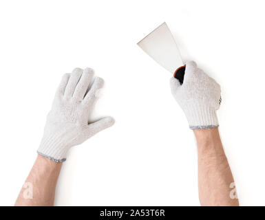 Vue rapprochée de l'homme dans les mains des gants de coton blanc avec un couteau à mastic Banque D'Images