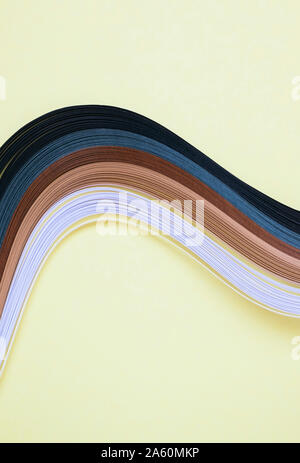 High angle view of multi colored art papers sur fond beige Banque D'Images