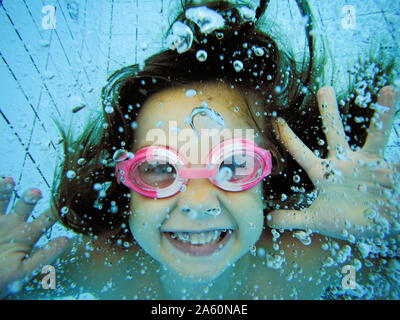 Underwater portrait of a happy girl