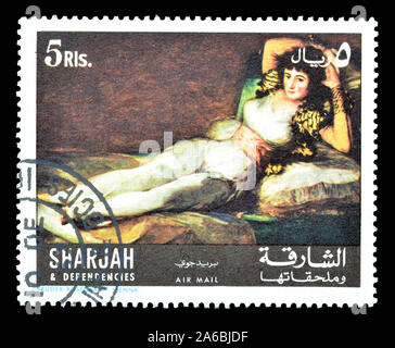 Timbre-poste imprimé par Sharjah, qui montre la peinture Maja vêtue, par Francisco José de Goya y Lucientes,circa 1967. Banque D'Images
