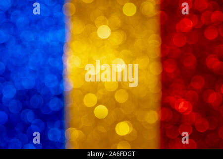 Résumé Contexte patriotique avec effet bokeh, defocused glitter avec bleu jaune et rouge brillant, modèle coloré, drapeau tricolore Banque D'Images