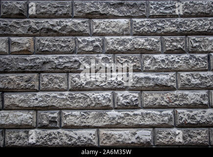 Arrière-plan de texture d'un vieux mur de pierre en calcaire. Couper soigneusement les briques grises et d'une bonne maçonnerie. Banque D'Images