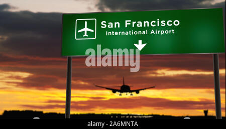 Silhouette de l'avion à l'atterrissage à San Francisco, Californie, États-Unis. Direction de l'aéroport d'arrivée Ville avec pancarte et le coucher du soleil en arrière-plan. Voyage Banque D'Images