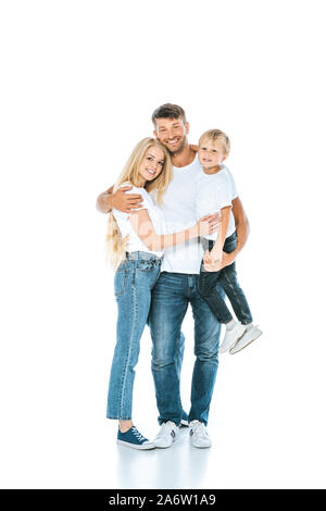 Happy man hugging épouse tout en tenant dans les bras son on white Banque D'Images