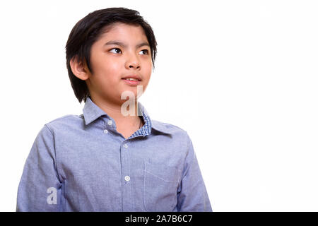 Studio shot of Japanese boy isolés contre fond blanc Banque D'Images