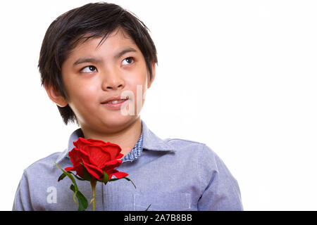 Studio shot of Japanese boy isolés contre fond blanc Banque D'Images