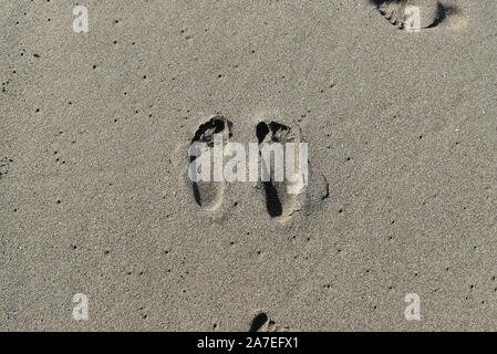 Des traces de pas dans le sable Banque D'Images