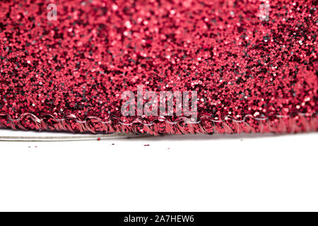 Macro fond lumineux de beaux mousseux rouge glitter ruban tissu texture avec bokeh Banque D'Images