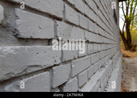 Mur de briques grises. La texture d'arrière-plan photo, close-up vue perspective. Banque D'Images