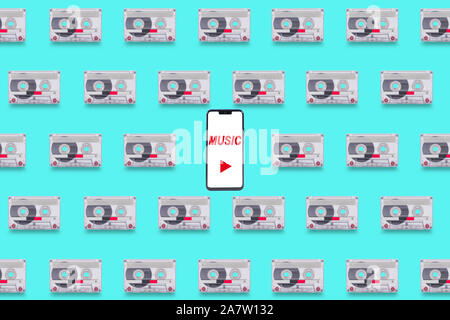 Contexte Avec l'ancien format de cassettes, avec un smartphone dans le centre comme une notion de comparaison entre les anciens et les nouveaux media device Banque D'Images