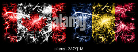 Canada, contre le Tchad, célébration du Nouvel An tchadien drapeaux fireworks mousseux fond concept. Combinaison de deux états abstraits des drapeaux. Banque D'Images