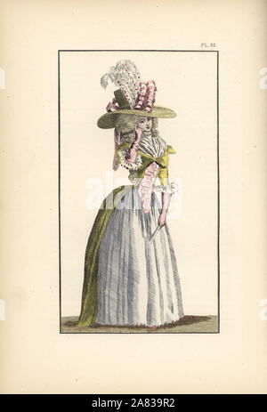 Femme en taffetas jaune canari demi-redingote, corsage blanc, rose a fait le jupon de taffetas, et fichu. Son chapeau de paille est décoré avec des rubans et des panaches. Lithographie coloriée de modes et coutumes de Marie Antoinette et son temps, par le Comte de Reiset, Paris, 1885. Le journal de Madame Eloffe, couturière et de lin-marchand à la Reine et des dames de la cour. Banque D'Images