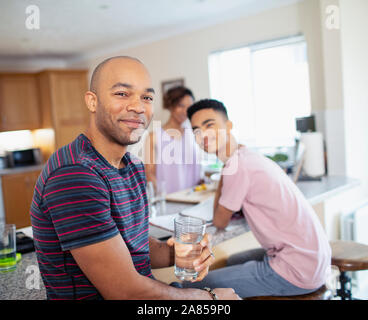 Portrait smiling family in kitchen