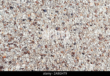 Gravillons lavés blanc ancien en pierre rustique rugueux texture pattern fond papier peint Banque D'Images