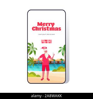 Man wearing santa claus hat avec phone on tropical beach nouvelle année Maison de vacances de Noël carte de voeux fond marin concept toute la longueur de l'écran du smartphone app mobile en ligne illustration vecteur vertical Illustration de Vecteur