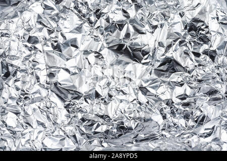 Close up de papier aluminium froissé, .Vue de dessus du papier aluminium Shinny Banque D'Images