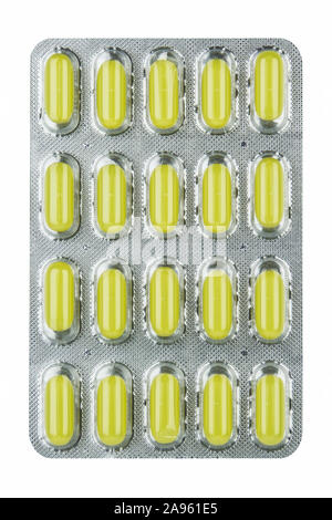 Blisteryellow comprimés sur un fond blanc. Banque D'Images