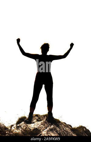 Silhouette féminine dans la région de Victor poser sur un rocher in front of white background Banque D'Images