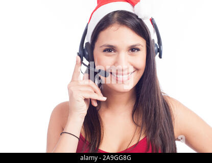 Casque femme de Noël centre d'appels de télémarketing porter du rouge santa hat smiling parlant isolé sur fond blanc. Banque D'Images