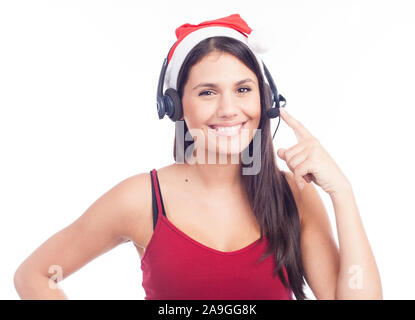 Casque femme de Noël centre d'appels de télémarketing porter du rouge santa hat smiling parlant isolé sur fond blanc. Banque D'Images