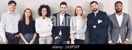 Composite smiling to camera in office Banque D'Images