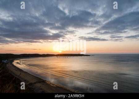 Soleil derrière Porthdinllaen vu de Morfa, Nefyn Péninsule Llŷn, Gwynedd, Pays de Galles Banque D'Images